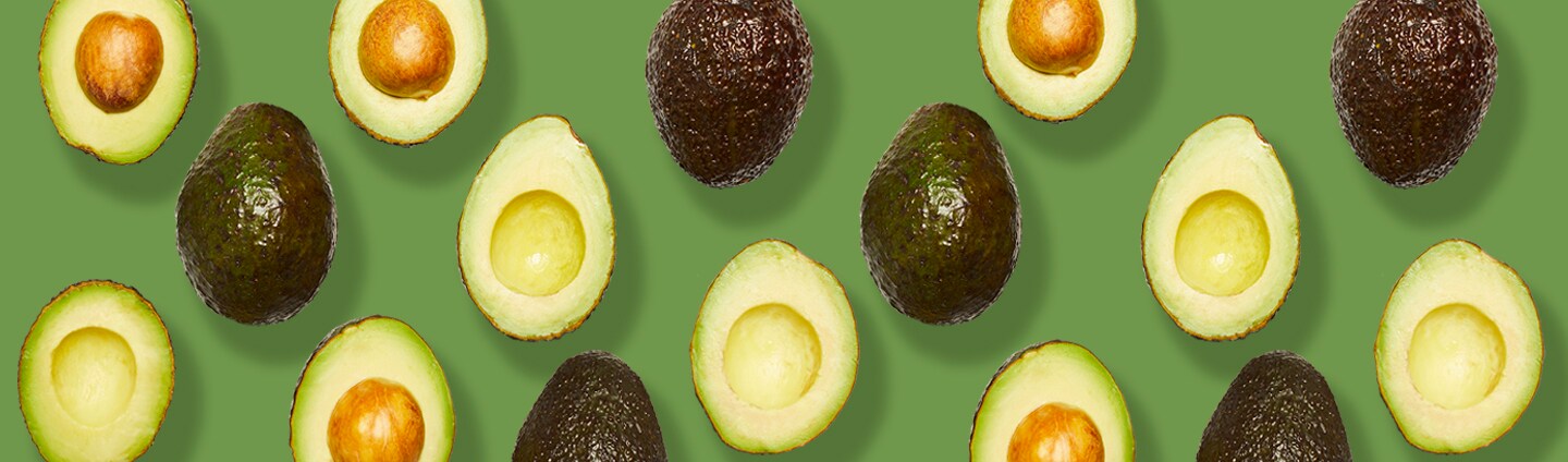 Assorted whole and halved avocados