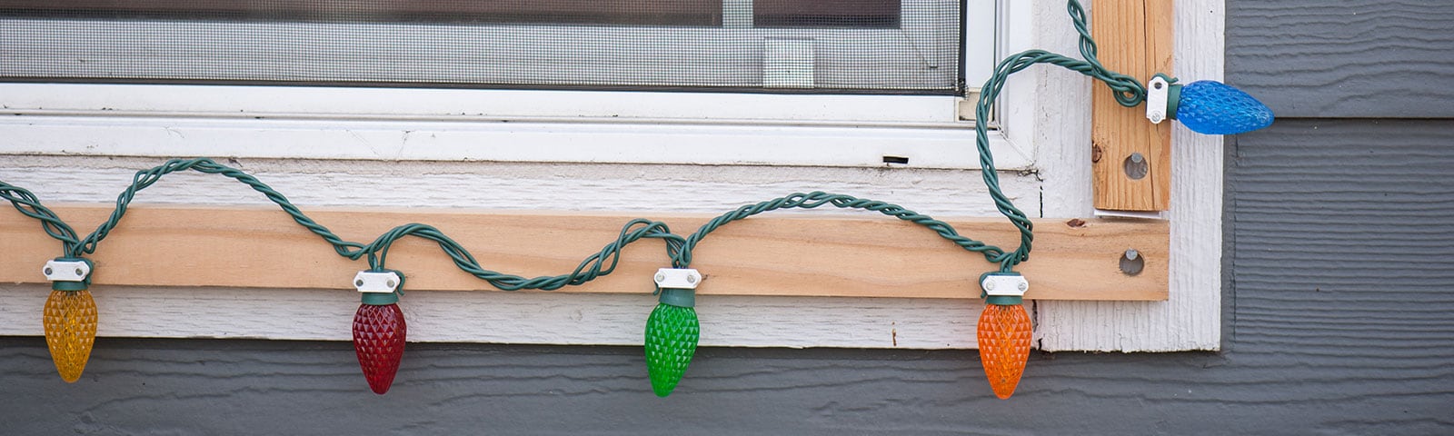 Christmas lights around window