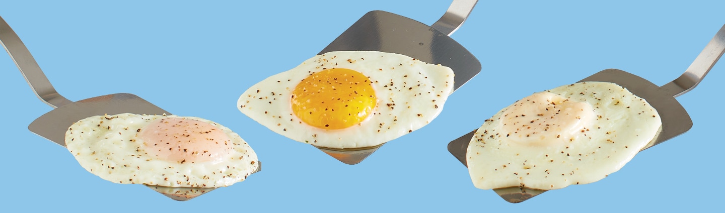 3 different styles of fried eggs each on spatula